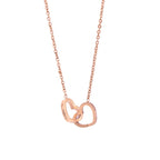 Rose gold personalized double heart name necklace on white background