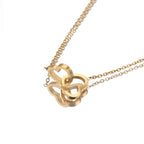 Gold double heart name necklace highlighting engraved personalized hearts