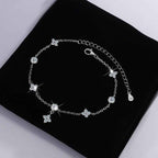 Sterling silver zodiac bracelet with diamond-cut moissanite centerpiece