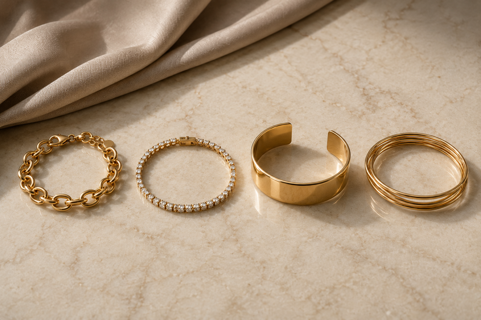 Gold chain tennis cuff and bangle bracelets for a black dress