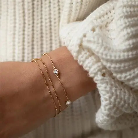 chain bracelets for women layered in gold and silver styles