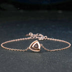 Detailed shot of garnet gemstones in silver geometric bracelet