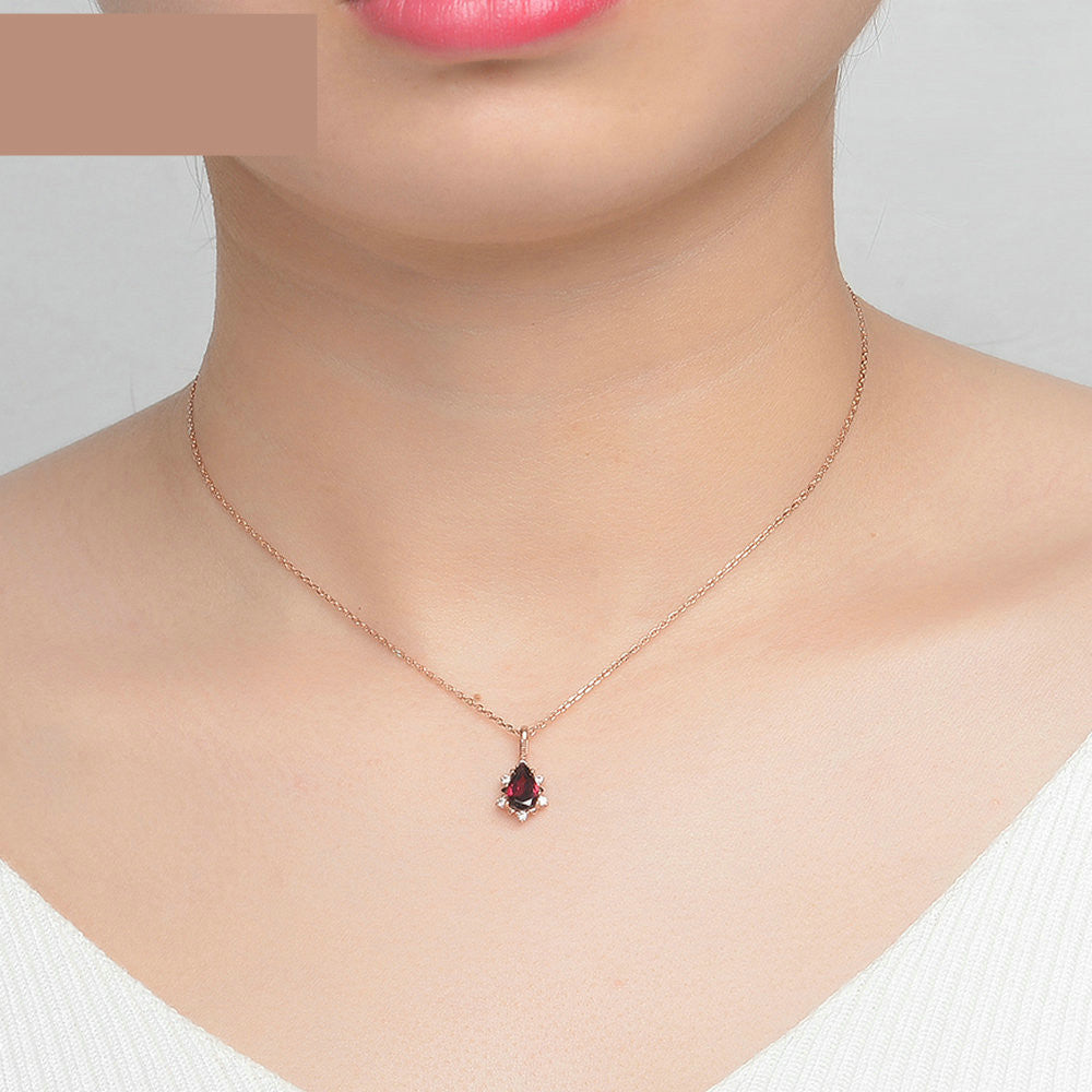 Garnet Drop Necklace worn by model, showing adjustable 925 sterling silver chain and elegant red garnet pendant
