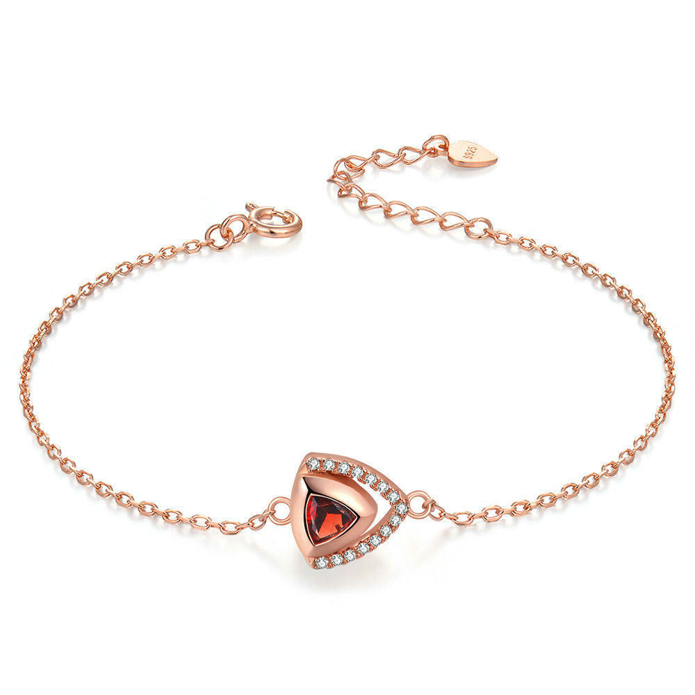 Garnet geometric silver bracelet close-up on white background