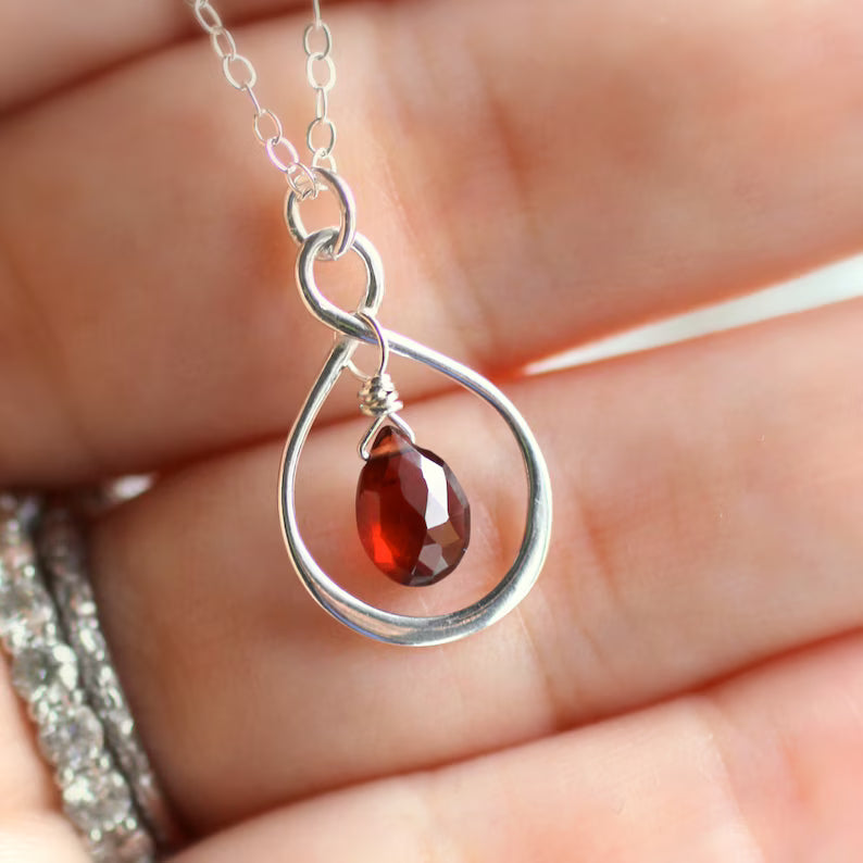Garnet necklace as a January birthstone gift with deep red gemstone